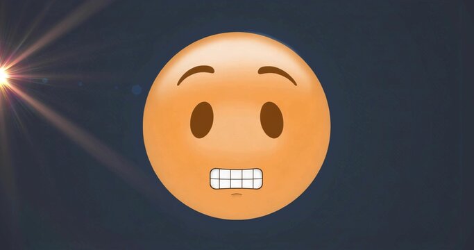 Displaying yellow-orange grimacing emoji on dark blue gradient background, with lens flare effect