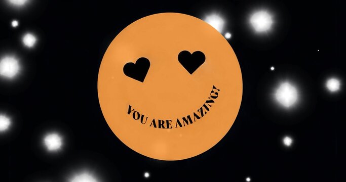 Displaying orange emoji with heart eyes and YOU ARE AMAZING? smile in digital space, glowing orbs - Powered by Adobe