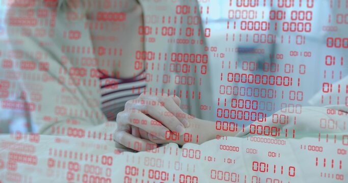 Showing mother and daughter placing hands on white tabletop at home, with red binary code overlay