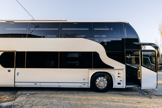 Highend vehicle situated at service station with operator