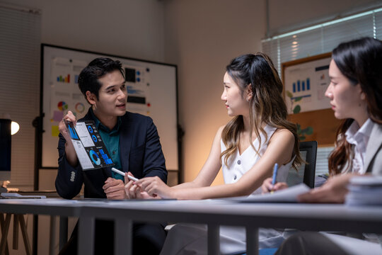 Business people discussing data analysis during office meeting