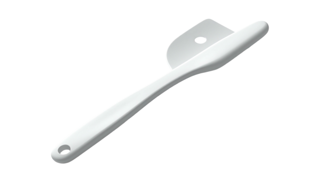White plastic spatula-like kitchen tool on dark background