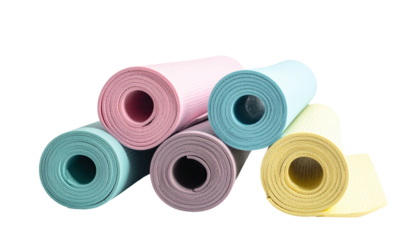 Rolled pastel yoga mats stacked together