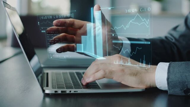 Business analyst typing on laptop with holographic dashboards and charts in modern office, data analytics and financial reporting for strategy, performance tracking and digital transformation - Powered by Adobe