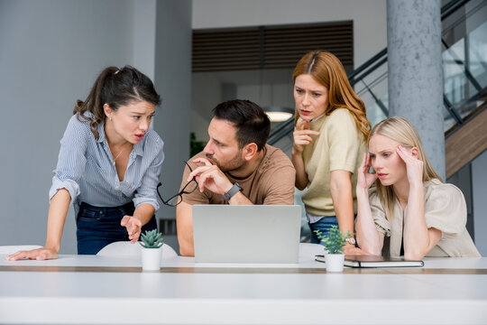 Business team discussing finance problems in office setting