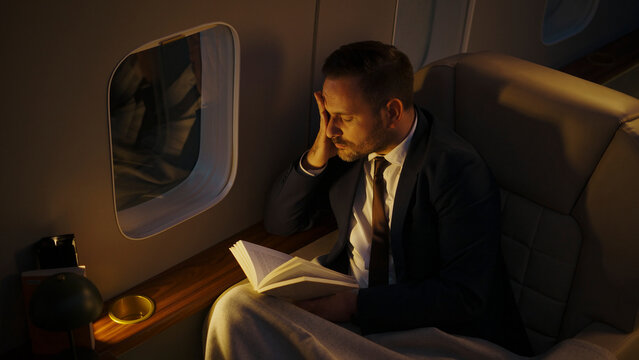 Business executive asleep in a private jet cabin, suit-clad and exhausted after nonstop travel, highlighting luxury travel fatigue and the toll of a busy corporate life