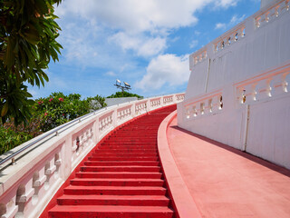 The red staircase leading up and down Golden mountain ( Phu Khao Thong) at Wat Saket one of Bangkok's most iconic landmarks, is popular among international tourists visiting Bangkok, Thailand.