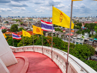 The red staircase leading up and down Golden mountain ( Phu Khao Thong) at Wat Saket one of Bangkok's most iconic landmarks, is popular among international tourists visiting Bangkok, Thailand.
