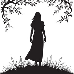 Silhouette of a woman in a long dress standing in grass under tree branches