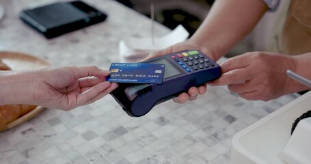 Close up of credit card being inserted into point of sale machine by customer during payment at small cafe representing cashless transaction and modern service in retirement business - Powered by Adobe