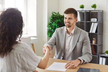Handshake of employer and candidate at job interview, business meeting. Confident happy businessman...