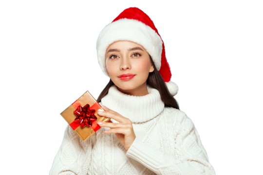 Beautiful woman in a white knitted sweater and santa hat with gift box isolated on transparent background. Christmas or New Year festivities. Holiday and Party - Powered by Adobe