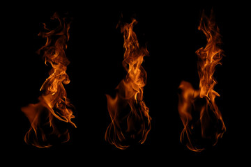 Blazing fire and glowing flames on a dark background perfect for creative design and visual effects.
