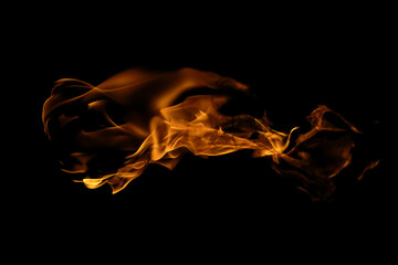 Blazing fire and glowing flames on a dark background perfect for creative design and visual effects.
