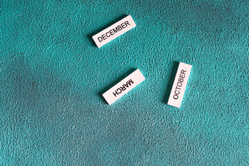 White tiles labeled December March October on teal background