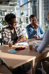 Fototapeta premium Diverse business colleagues collaborating during informal office meeting