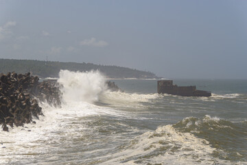 Dramatic Waves Crashing Against Tetrapod Sea Wall