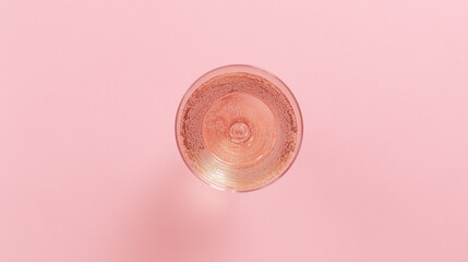 glass of water on pink