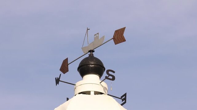 Weather Vane on top of harbour light. Port Erin. Isle of Man. UK