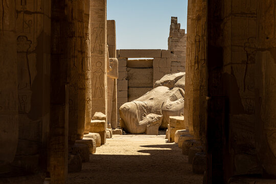 View of the Massive Fallen Colossus Statue of Ramses II Through Temple Columns