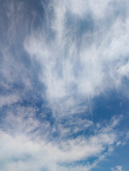 Dynamic Blue Sky with Wispy Cirrus Clouds and Faint Contrails