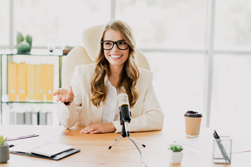 Confident businesswoman hosting a meeting in a modern office environment with professional attire...