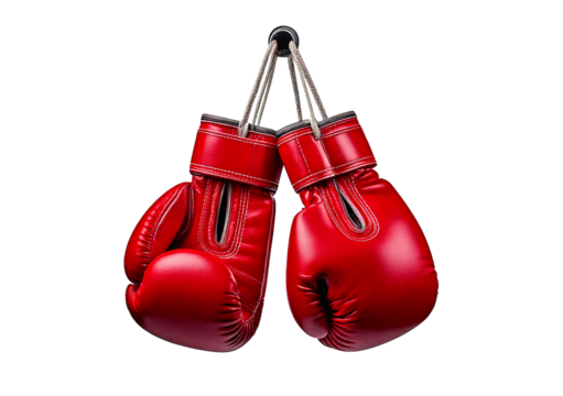 A pair of red boxing gloves hang from a hook, ready for use  isolated on transparent or white background