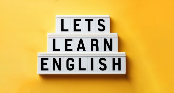 Lets learn english sign on a yellow background education and language learning concept study english language