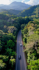 aerial view healthy environment concept, Road in the middle of the forest Concept of using electric cars