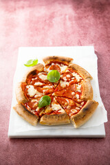 Traditional Pepperoni pizza with fresh basil