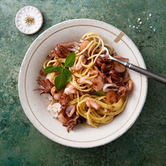 Spaghetti with seafood and basil