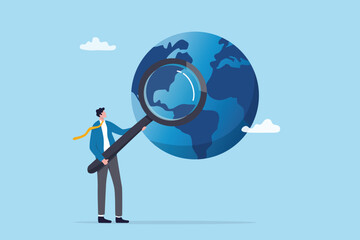 Global world economics analysis, international or oversea business research, investment or opportunity statistics, analyze profit investment portfolio, businessman analyze world with magnifying glass.