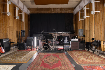 vintage rehearsal space prepared for musicians, cozy music studio equipped for recording