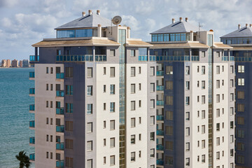 Residential apartment buildings in mediterranean coast. Spanish coastline skyline