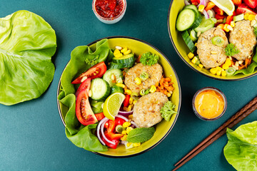 Fried cutlets in buddha bowl, fish patties.