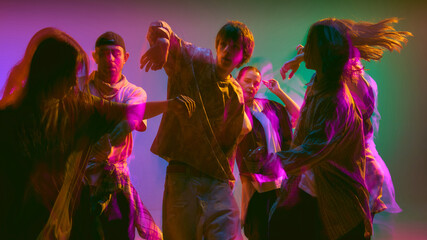 Contemporary dancers in expressive motion blur effect. Concept of body awareness, performing arts visuals, and creative campaign design for modern culture, education, and branding.