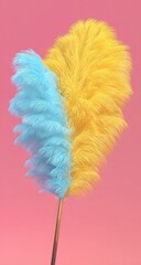 Colorful Feather Duster Against a Pink Background.