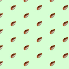 Flax seeds seamless vector pattern on light-green background