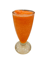 Refreshing orange smoothie in a glass on a white background.