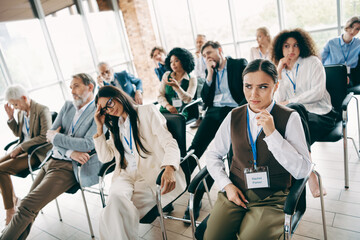 Diverse group at a business workshop with individuals expressing emotions and engaging in collaborative learning