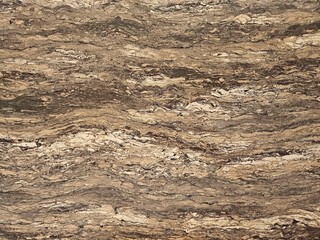 Naklejka premium Natural brown marble stone texture with organic wavy patterns, elegant surface background for interior design, architecture, and luxury material presentation