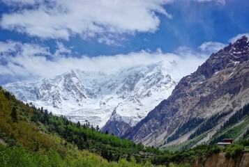 Tibetan Mountain Landscape with Dramatic Rock Formations and Snowy Summits