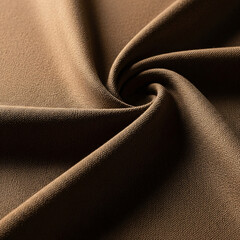 Close-up view of a soft brown textured fabric, showcasing its subtle folds and light-catching surface in a studio setting
