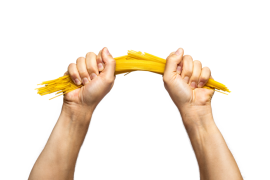 Two hands breaking spaghetti pasta in half isolated from background