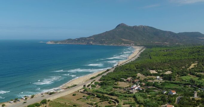 Aerial view of Buggerru coast in Sardinia, Italy on a sunny day, serene mood