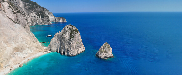 Aerial drone ultra wide panoramic photo of scenic small islet of Mizithres in Keri area forming...