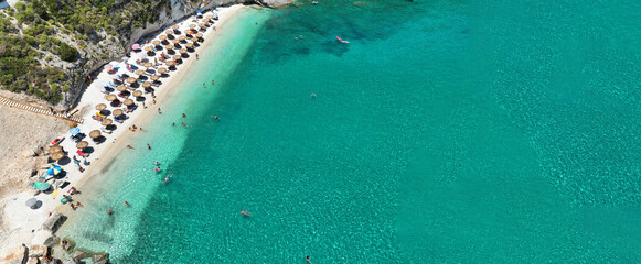 Aerial drone ultra wide photo of amazing organized sandy beach of Wolf rocks with emerald crystal clear sea, Zakinthos island, Ionian, Greece