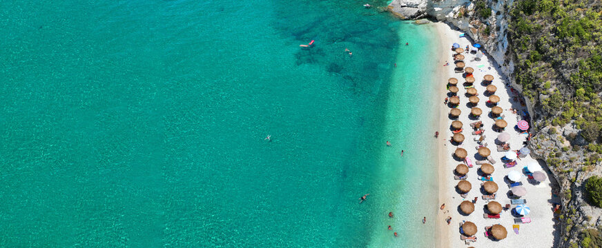 Aerial drone ultra wide photo of amazing organized sandy beach of Wolf rocks with emerald crystal clear sea, Zakinthos island, Ionian, Greece