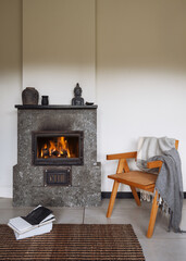 Naklejka premium Cozy fireplace in a modern living room for warmth and comfort in winter