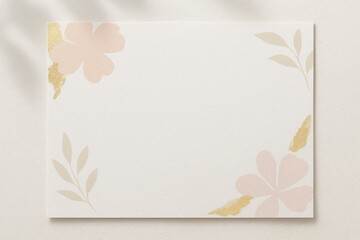 Blank floral card with gold foil accents and soft pastel flowers on textured paper, elegant template for invitation or greeting design.